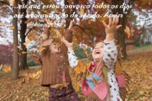 Little Girls Playing in the Leaves --- Image by © Rick Gomez/Corbis